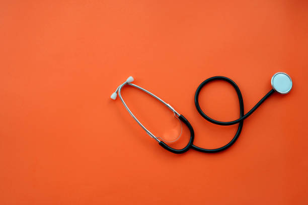 stethoscope on color background